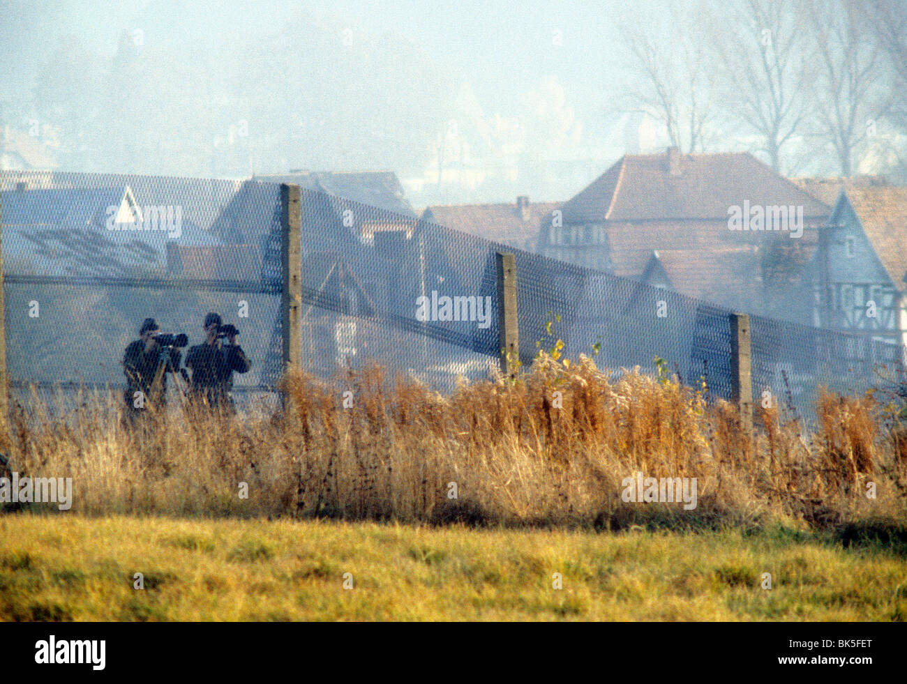 DDR troops photographing from the eastern side of the Iron Curtain 1982 Stock Photo