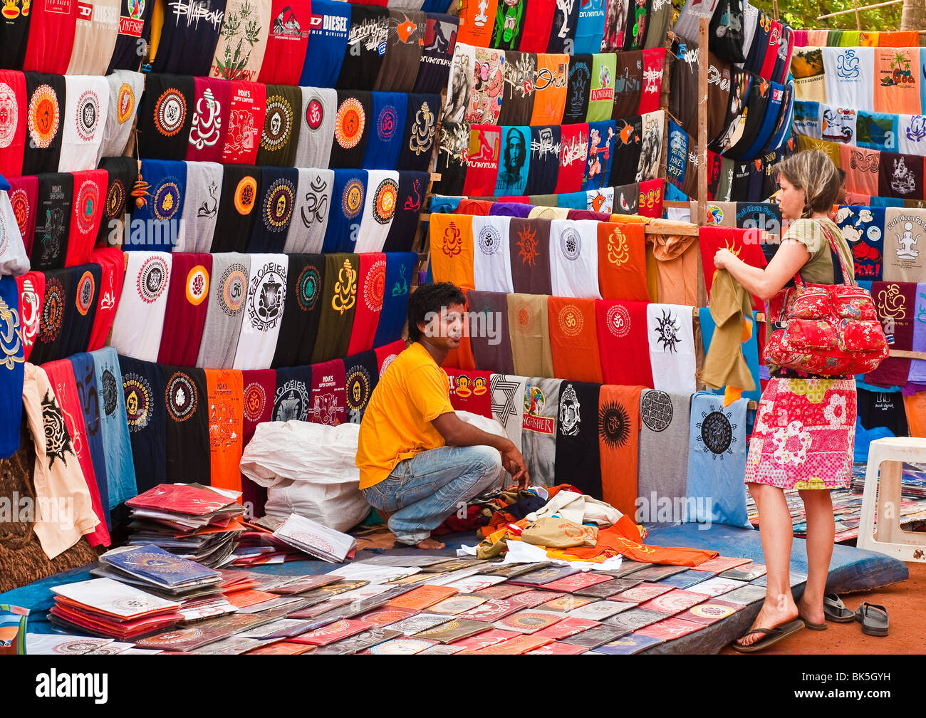 Colourful Indian clothing for sale at the Anjuna Flea Market, Goa, India Stock Photo