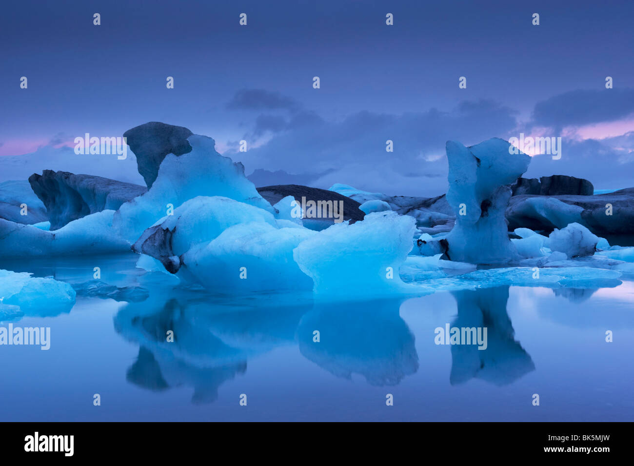 Icebergs in Jokulsarlon glacial lagoon, at dusk, East Iceland, Iceland, Polar Regions Stock Photo