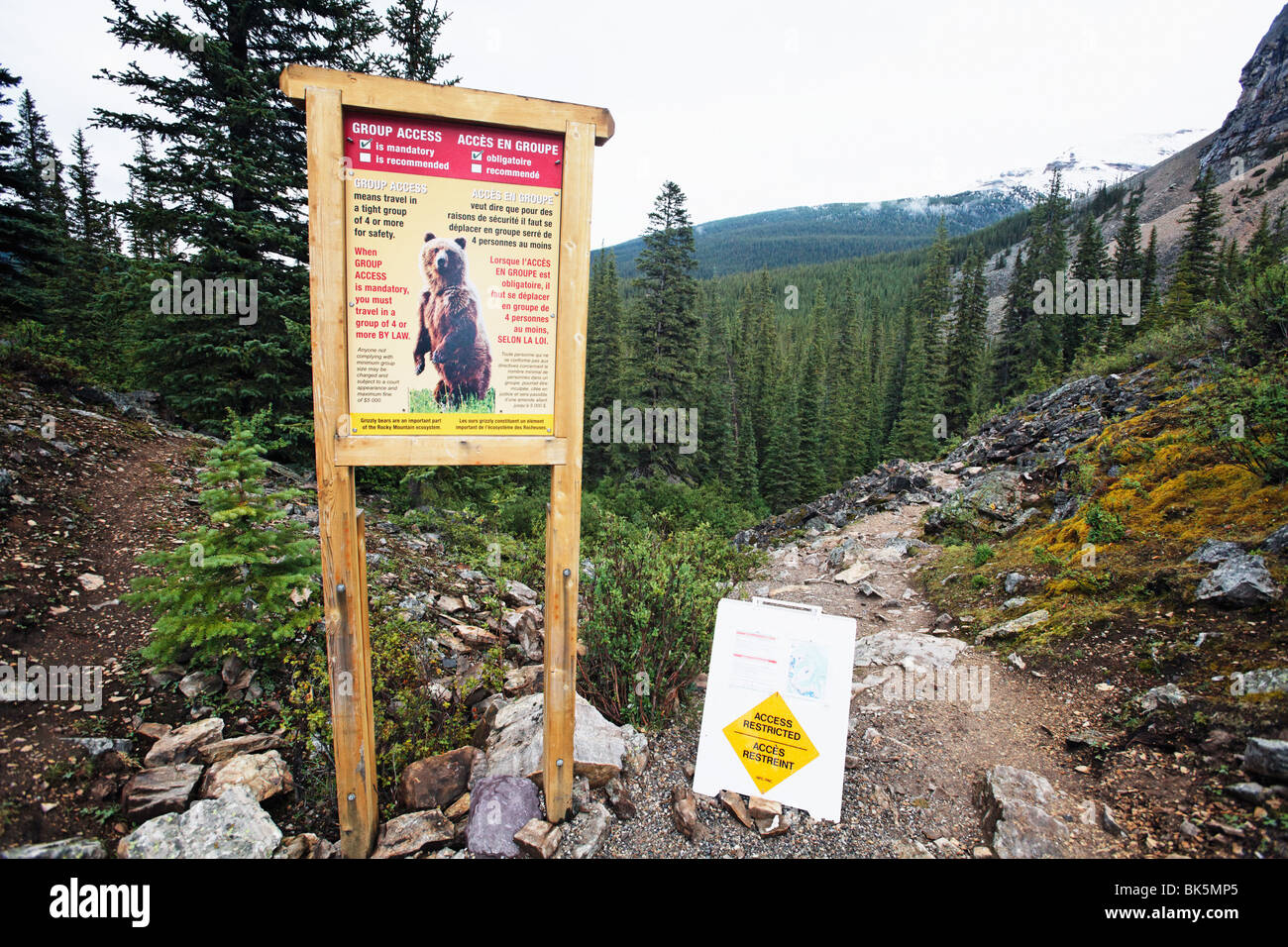 Group Access Mandatory Sign on a Hiking Trail, Banff National Park, Alberta, Canada Stock Photo