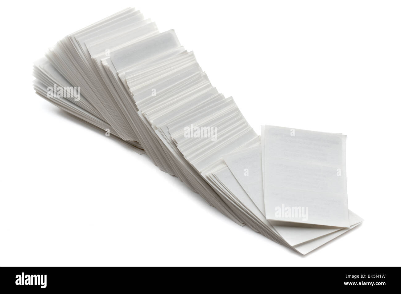 Pile of white sticky backed business labels Stock Photo