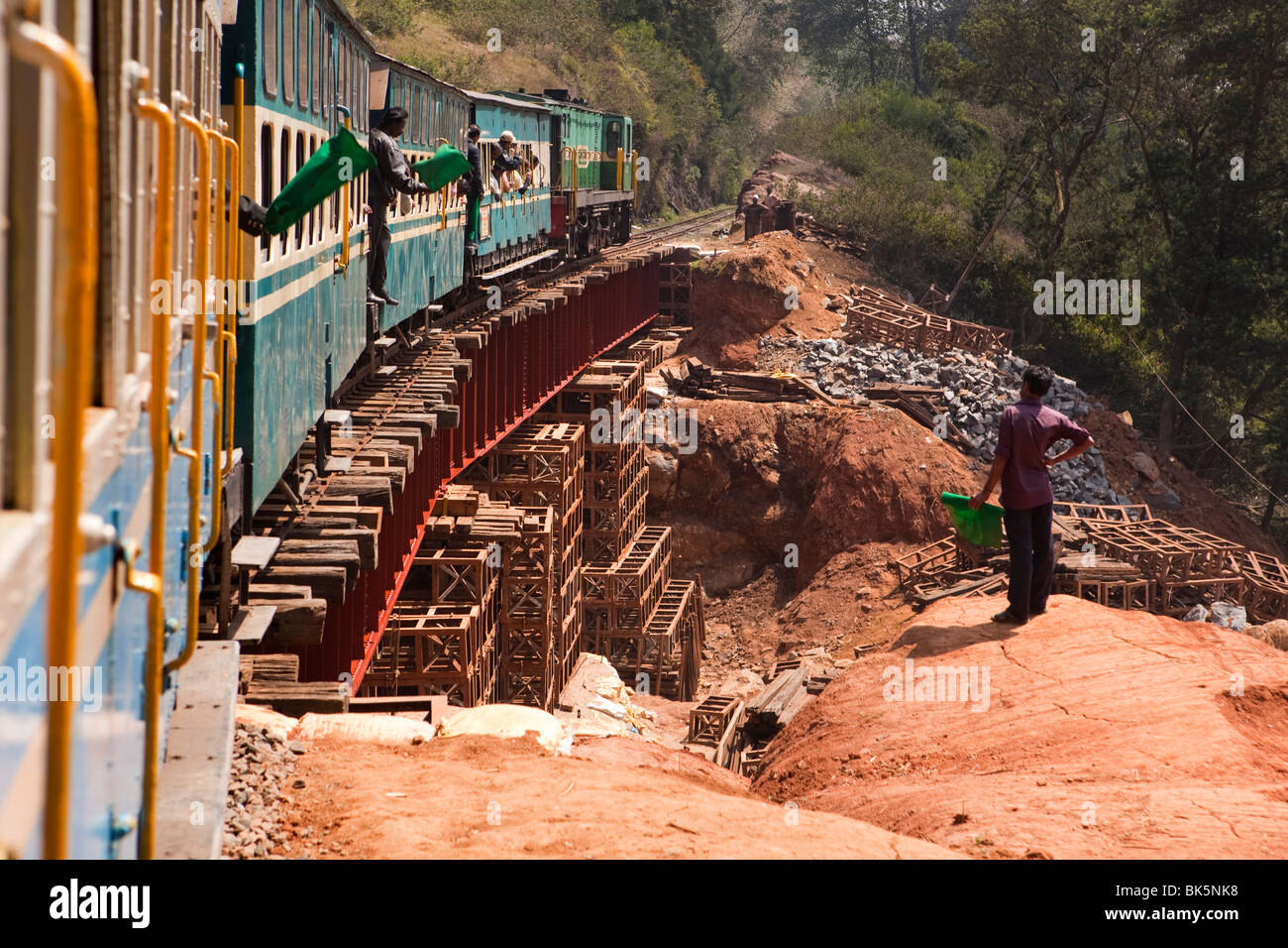 India, Tamil Nadu, Udhagamandalam (Ooty), Nilgiri Mountain Railway rack train crossing temporary bridge over damaged track Stock Photo