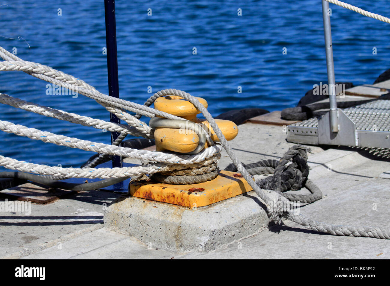 Ropes and yellow bollard, Hout Bay Harbour, Cape Town ,South Africa