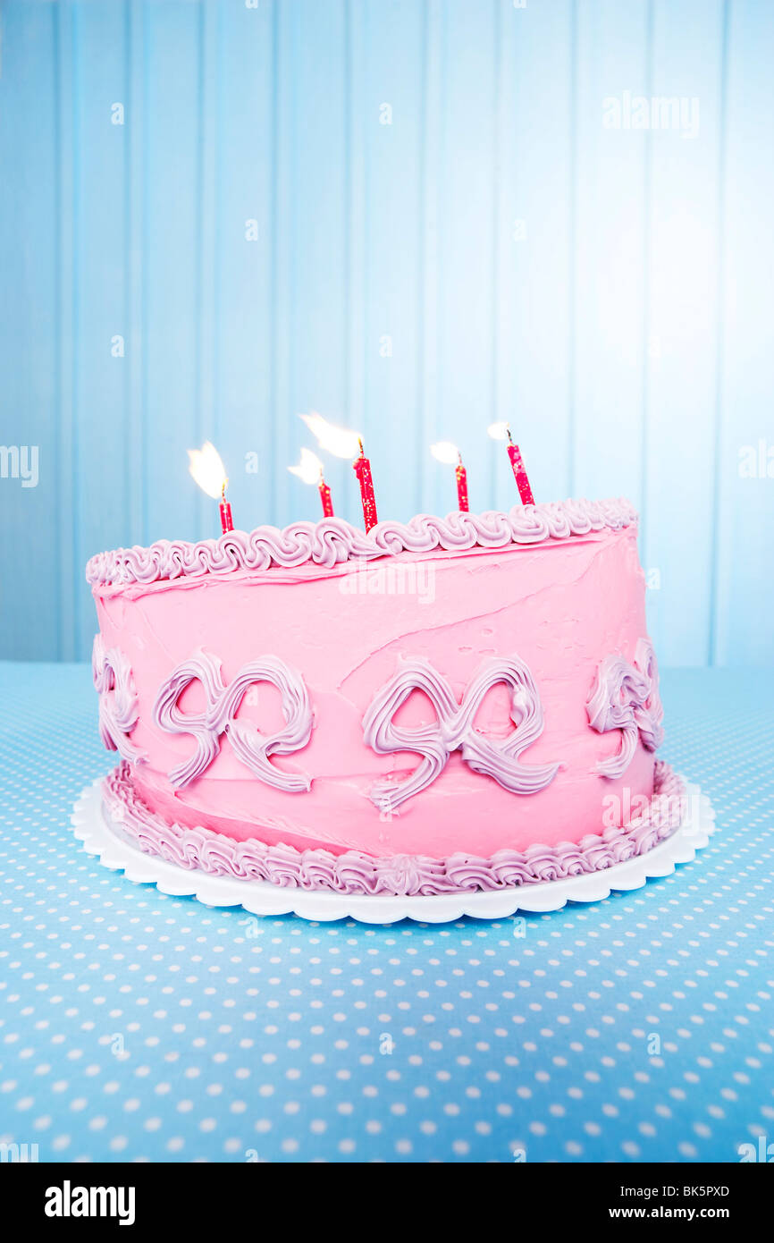 Lopsided Birthday Cake with Candles Stock Photo