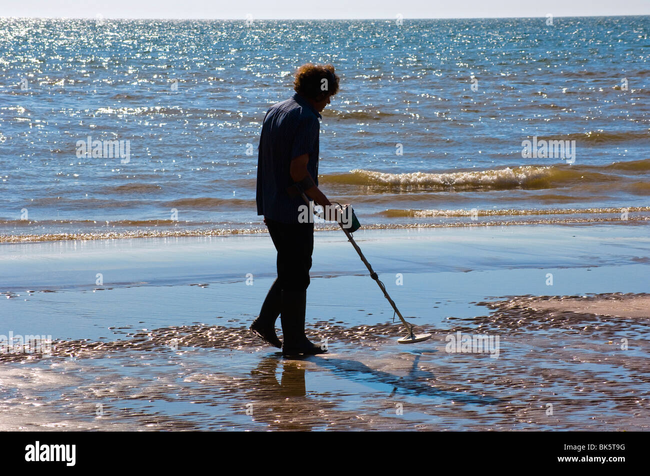 Man using metal detector on beach at Blackpool, England Stock Photo Alamy