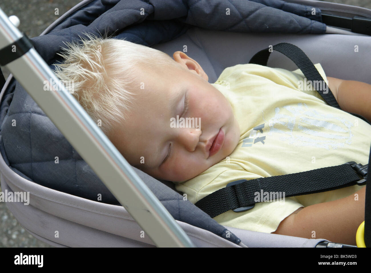 Baby asleep pram hi-res stock photography and images - Alamy