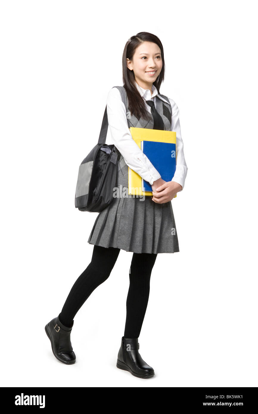 Schoolgirl holding her books Stock Photo - Alamy