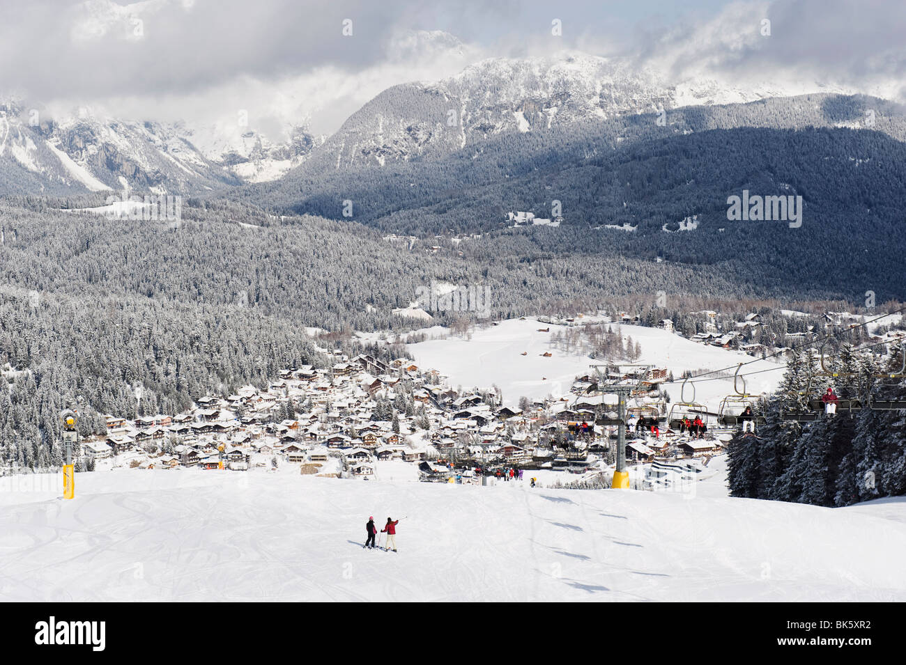 Skiers on a piste above Seefeld village, Seefeld, the Tyrol, Austria, Europe Stock Photo