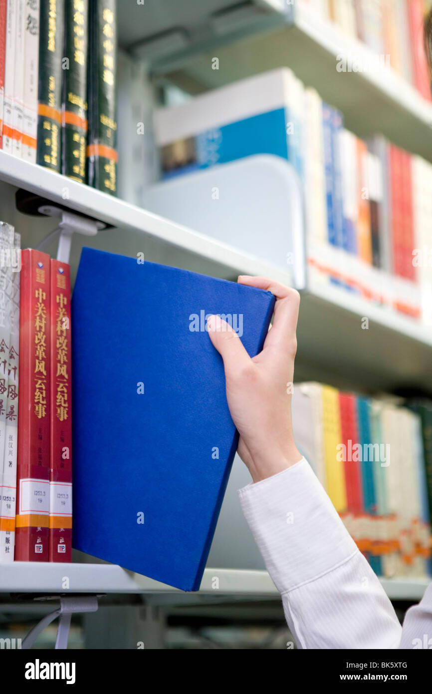 Picking out a book Stock Photo Alamy Picking out a book Stock Photo Alamy