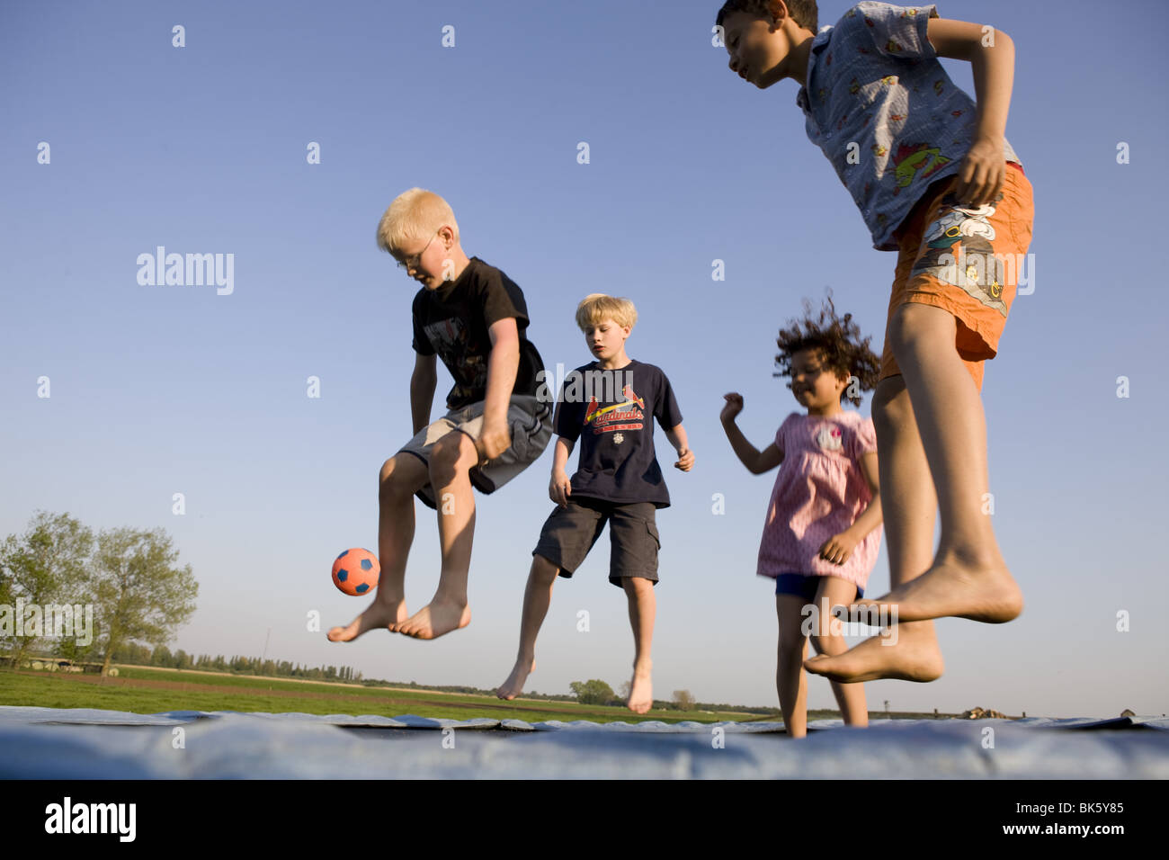 Kids jump hi-res stock photography and images - Alamy