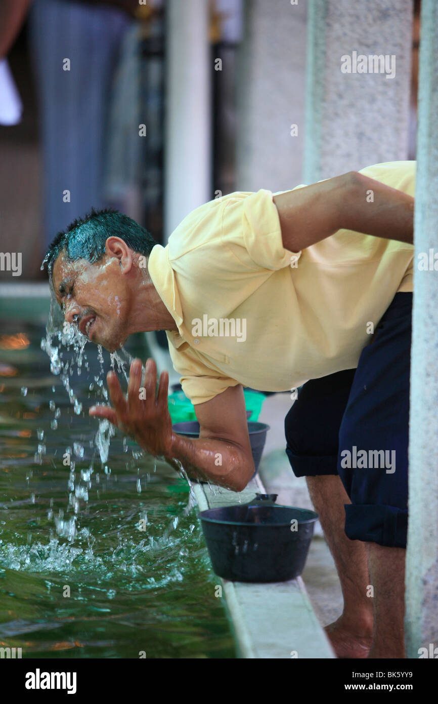 Washing,  Kapitan Kling Mosque, Penang, Malaysia, Southeast Asia, Asia Stock Photo