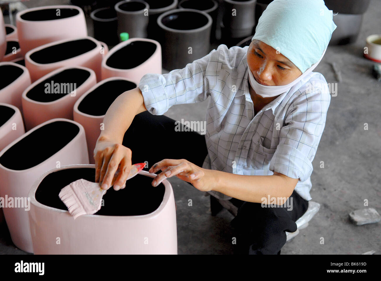 Worker in a pottery factory, Bat Trang, Vietnam, Indochina, Southeast Asia, Asia Stock Photo
