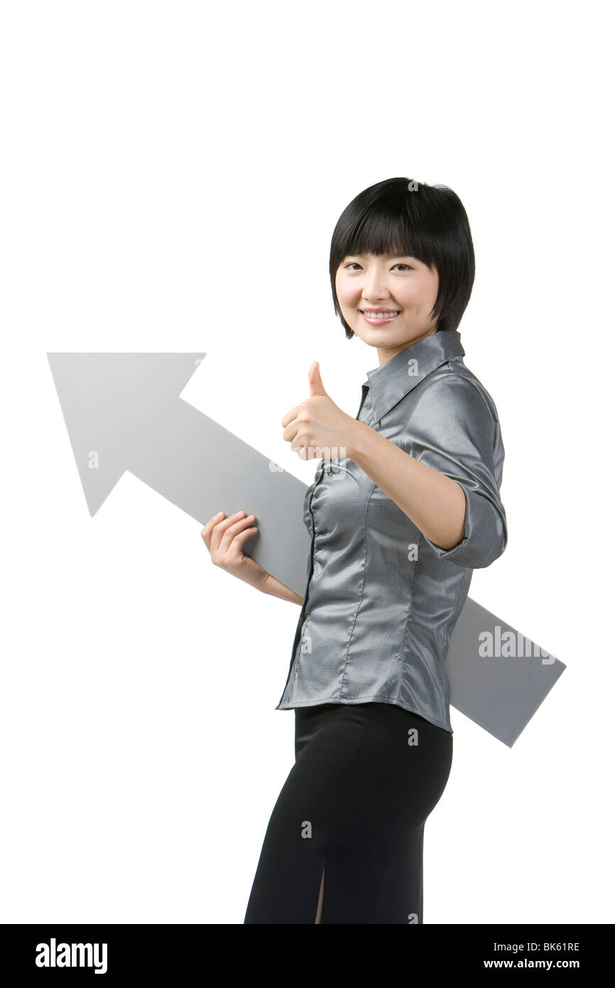 Young woman holding arrow hi-res stock photography and images - Alamy