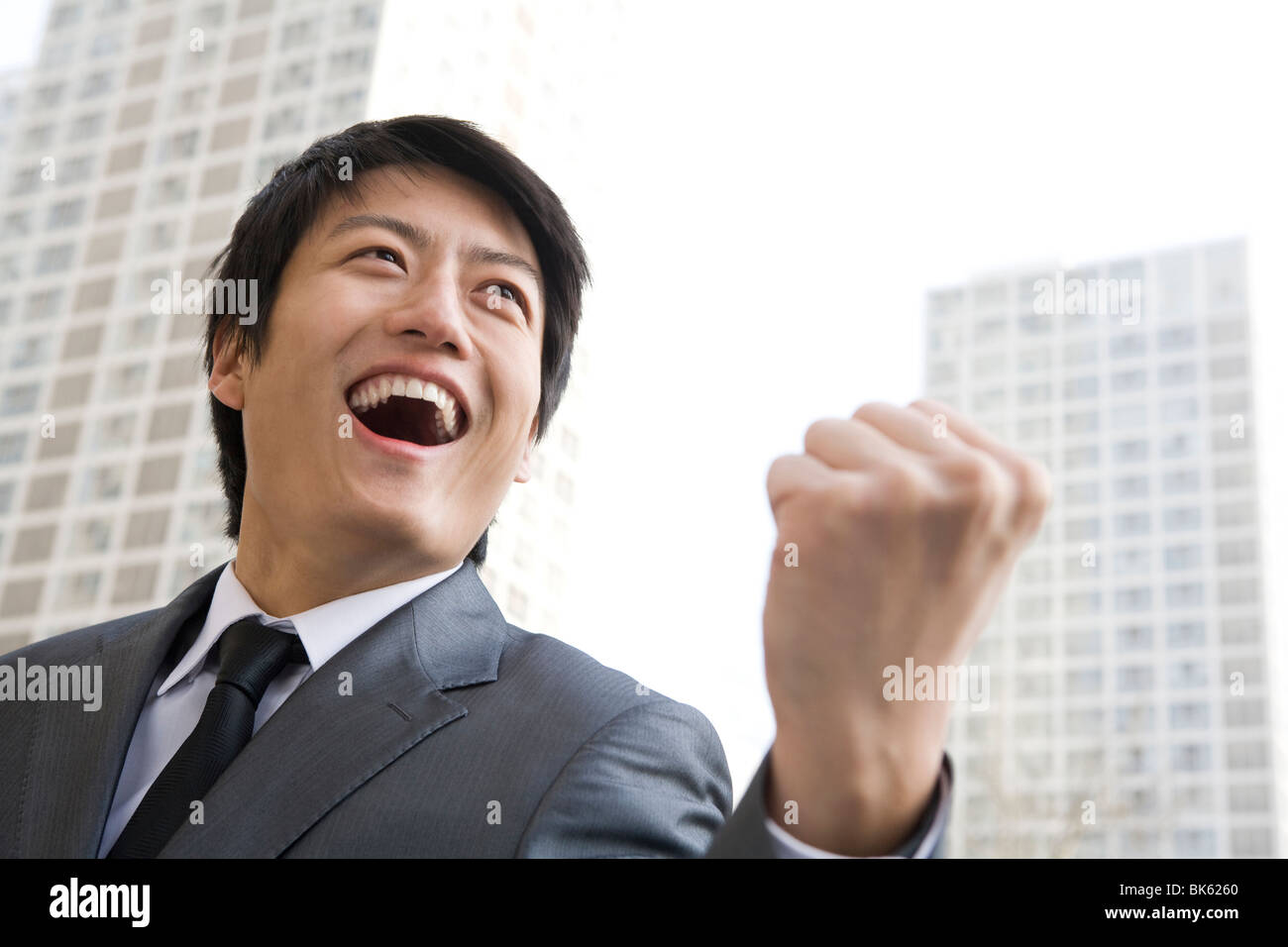 Businessman punching the air Stock Photo Alamy