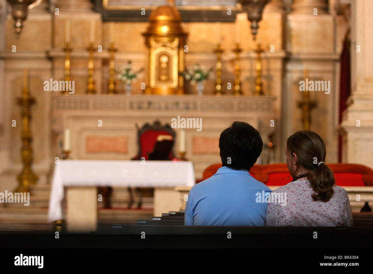 Catholic couple in church, Lisbon, Portugal, Europe Stock Photo