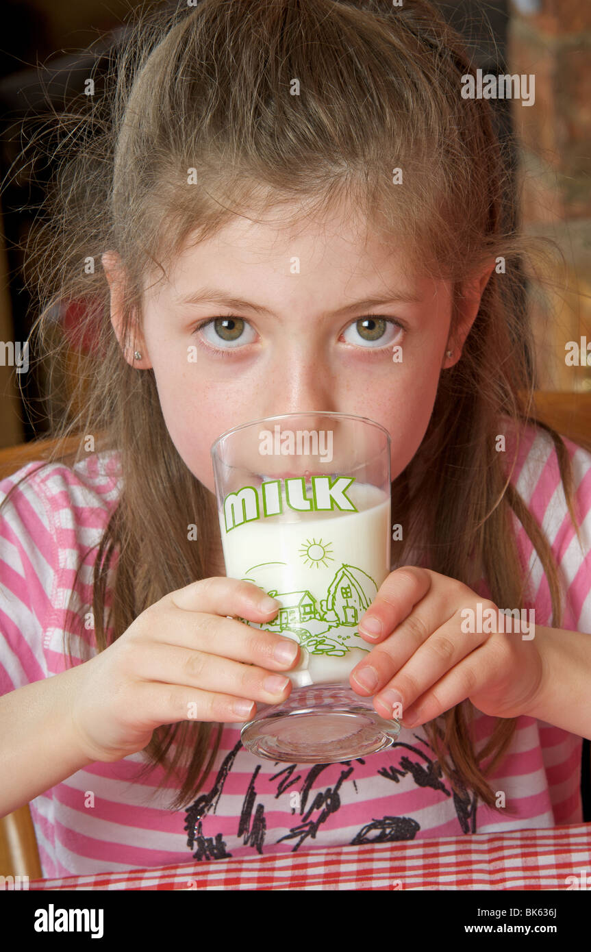Young girl drinking glass of milk Stock Photo Alamy