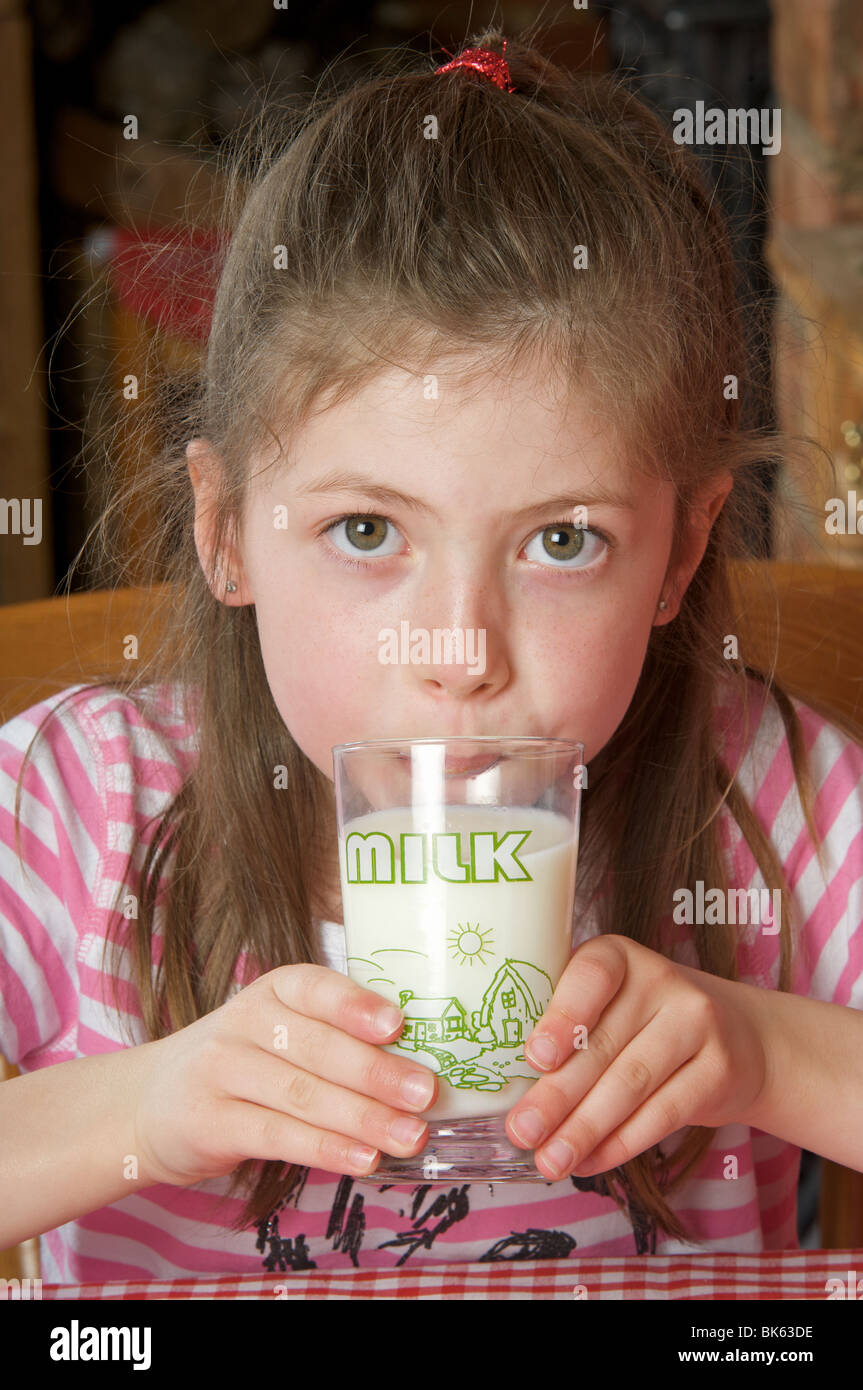 Young girl drinking glass of milk Stock Photo Alamy
