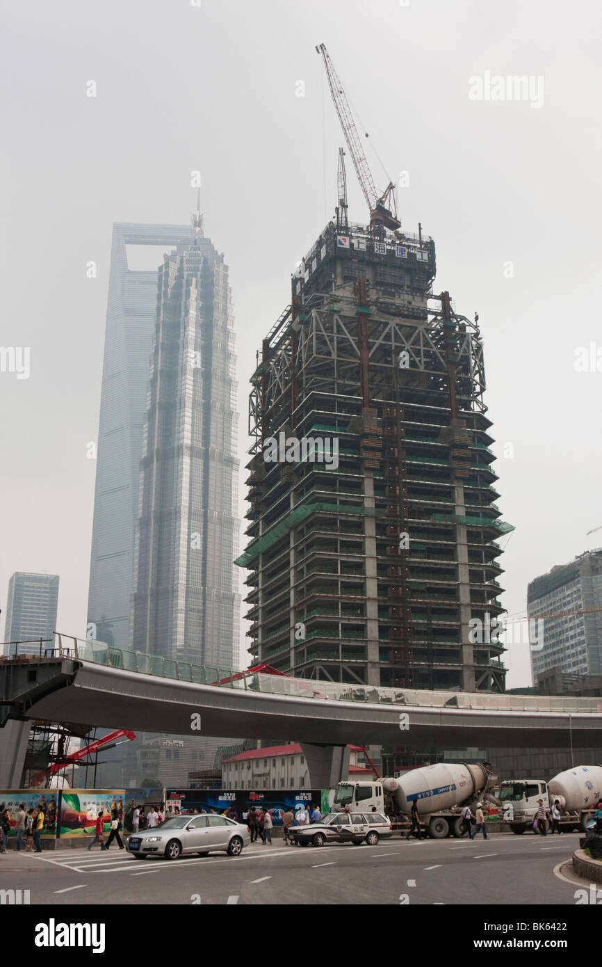 Skyscraper under construction by day in Shanghai China Stock Photo - Alamy