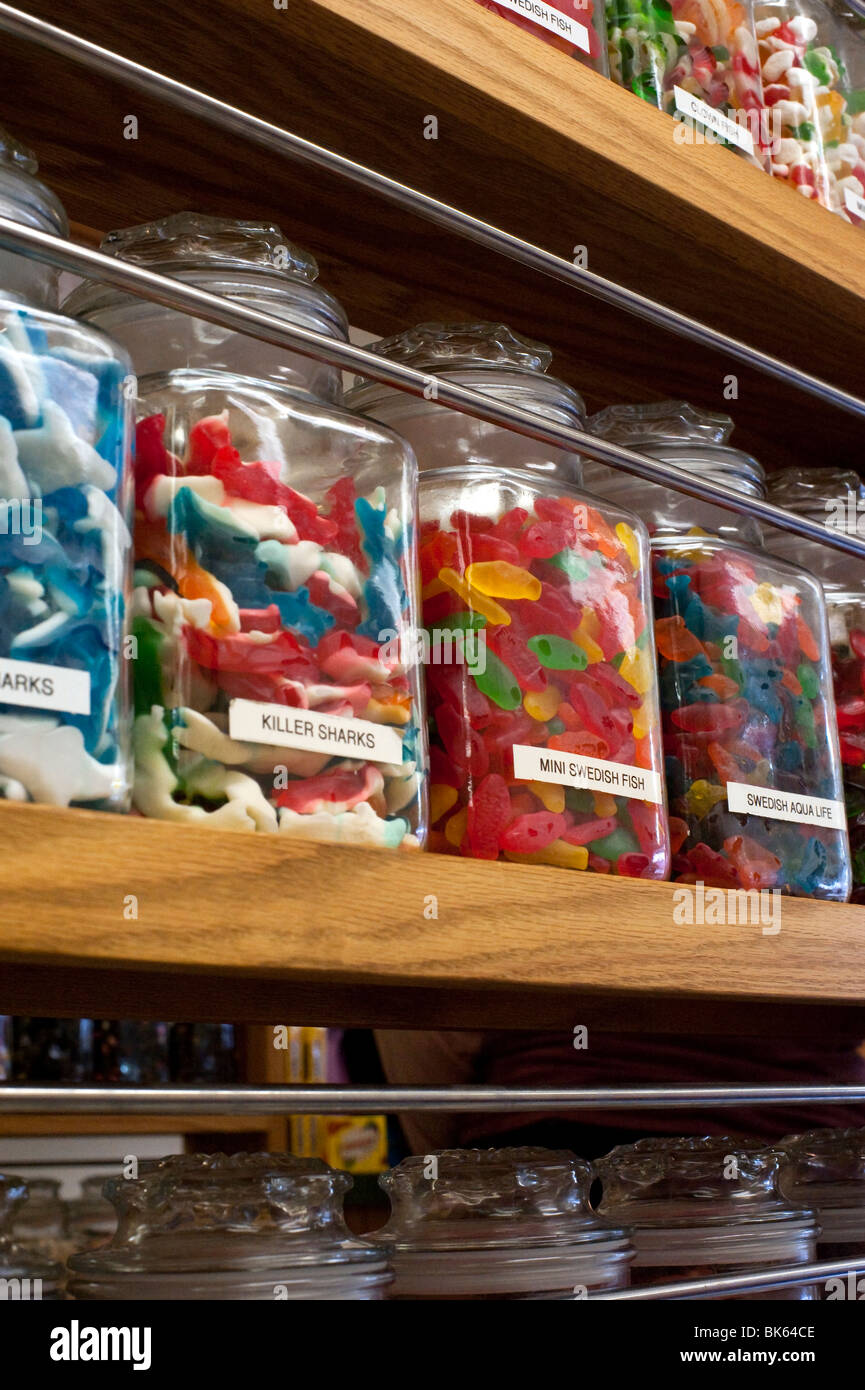 Candy jars on the shelves in a candy store Stock Photo Alamy