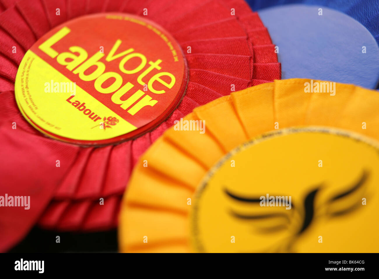 General Election UK Labour Liberal Democrats and Conservative party rosette Stock Photo