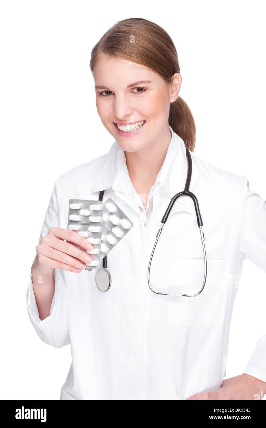 Full isolated studio picture from a young and beautiful doctor with pills Stock Photo