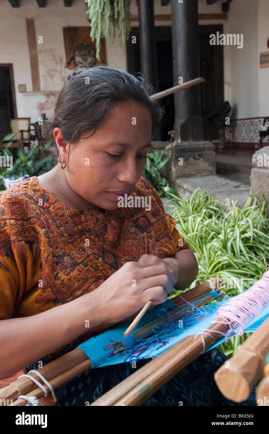 Woman weaving cloth, Antigua, Guatemala, Central America Stock Photo
