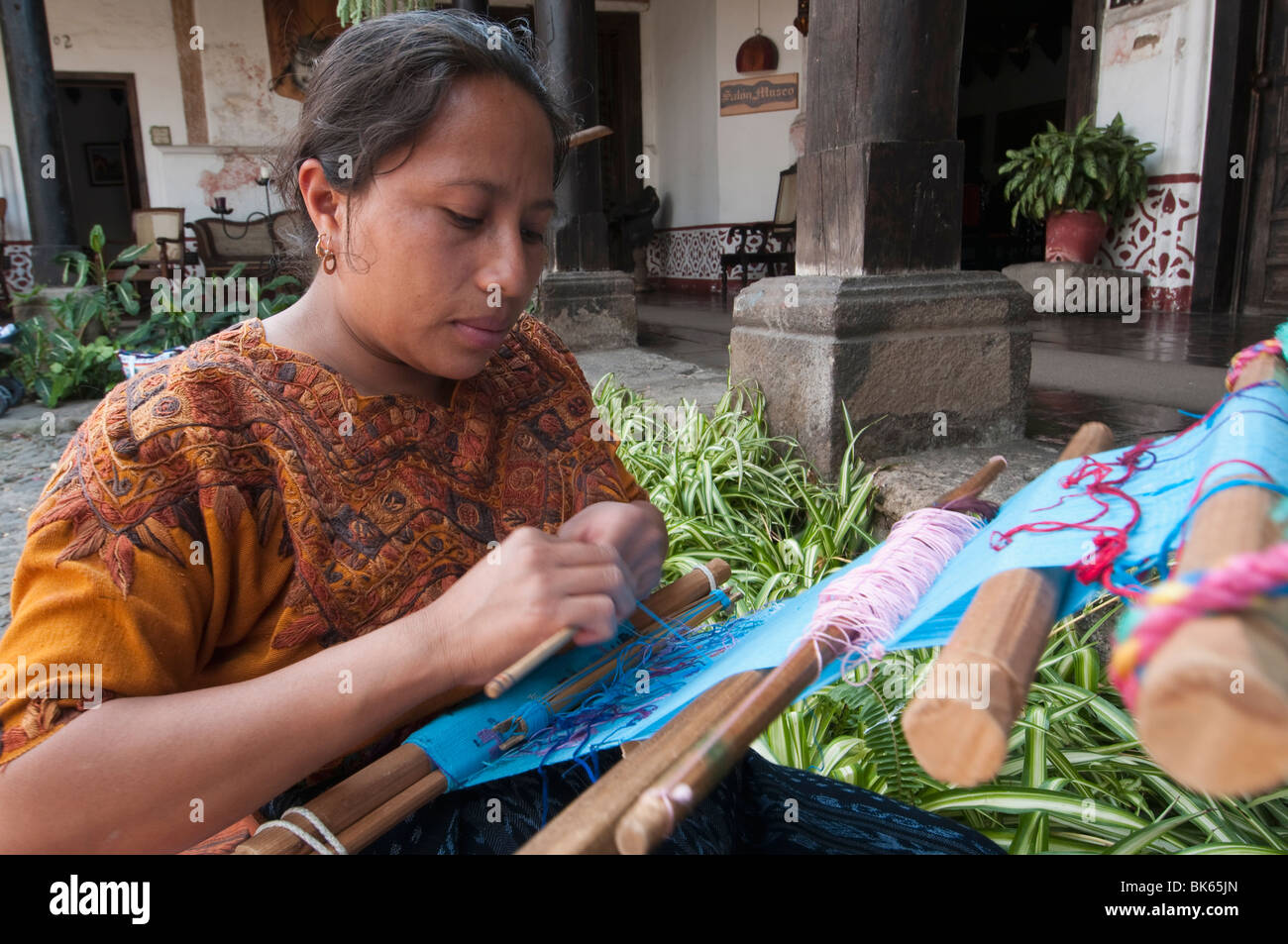 Woman weaving cloth, Antigua, Guatemala, Central America Stock Photo