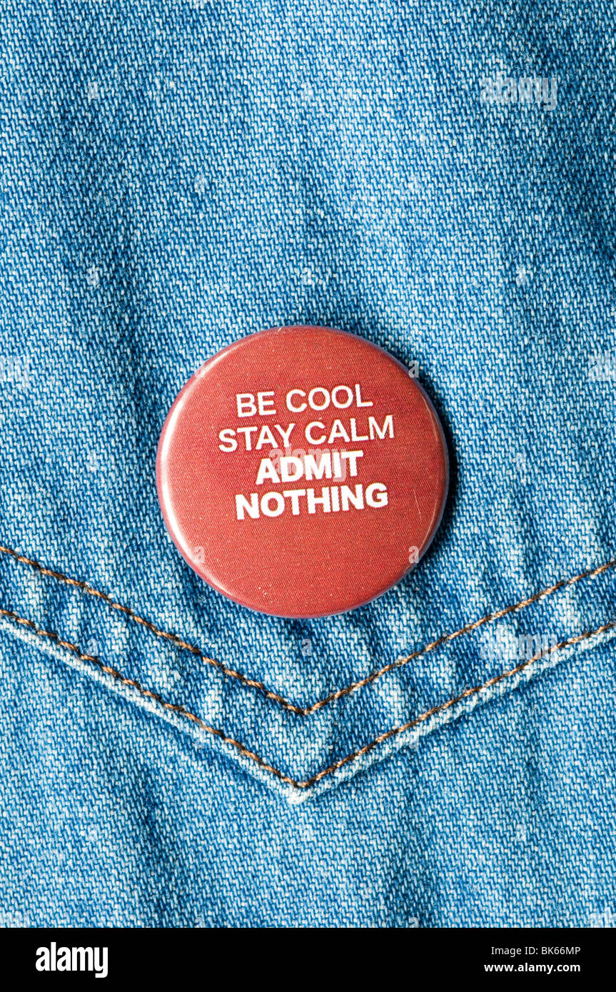 Be Cool Stay Calm Admit Nothing badge on denim jacket Stock Photo