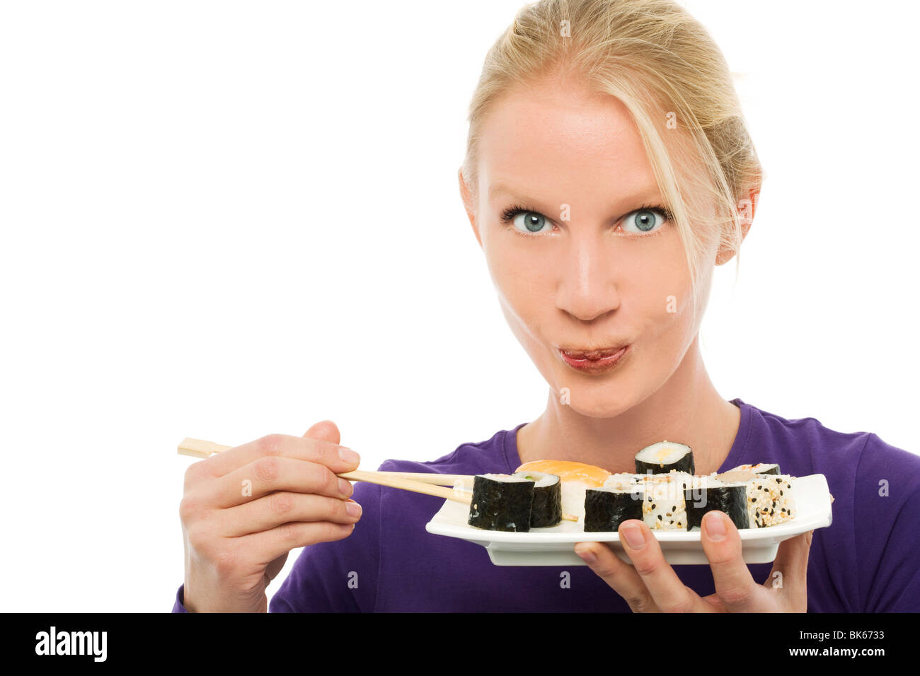 portrait of a young caucasian woman eating sushi Stock Photo Alamy