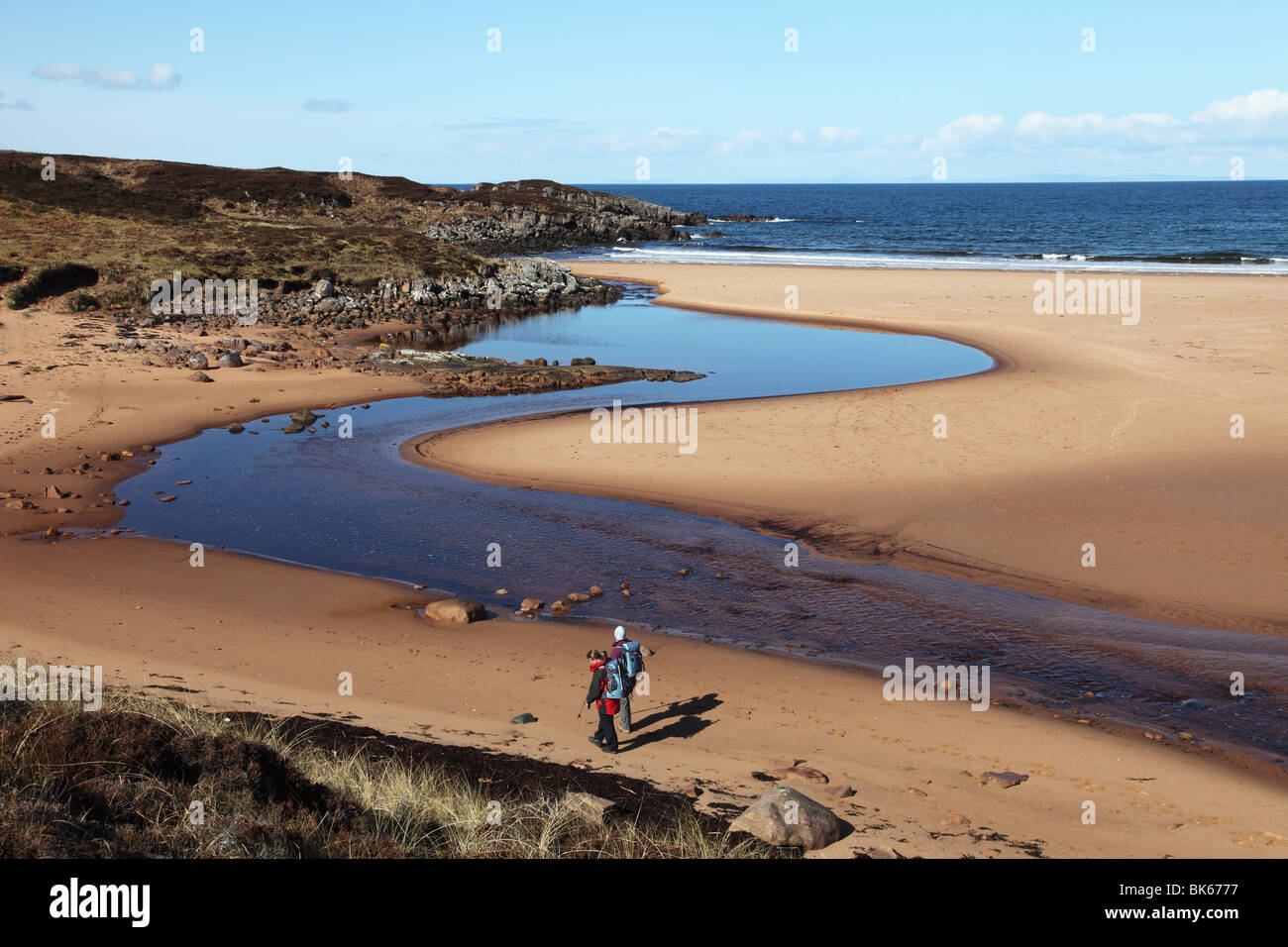 Walkers on the Beach at Red Point Wester Ross West Coast of Scotland UK Stock Photo