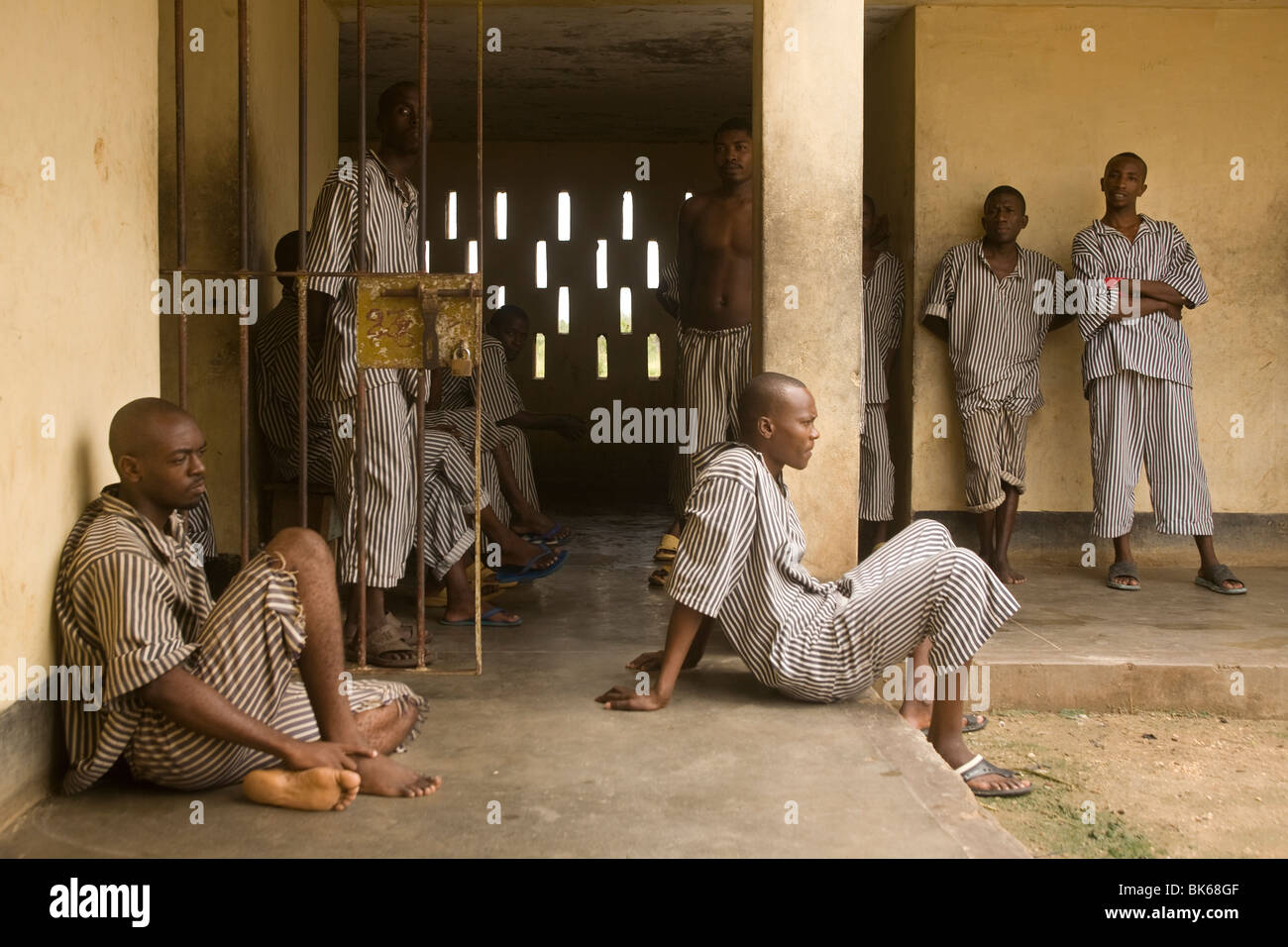 Prisoners rest outside their cells on October 15, 2009 in an unidentified prison on the coast of Kenya. Stock Photo