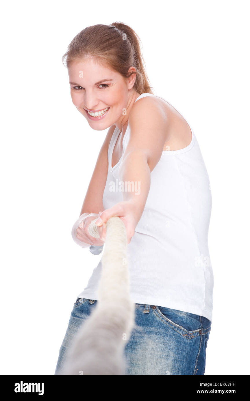 Full isolated studio picture from a young and beautiful woman doing tug of war Stock Photo