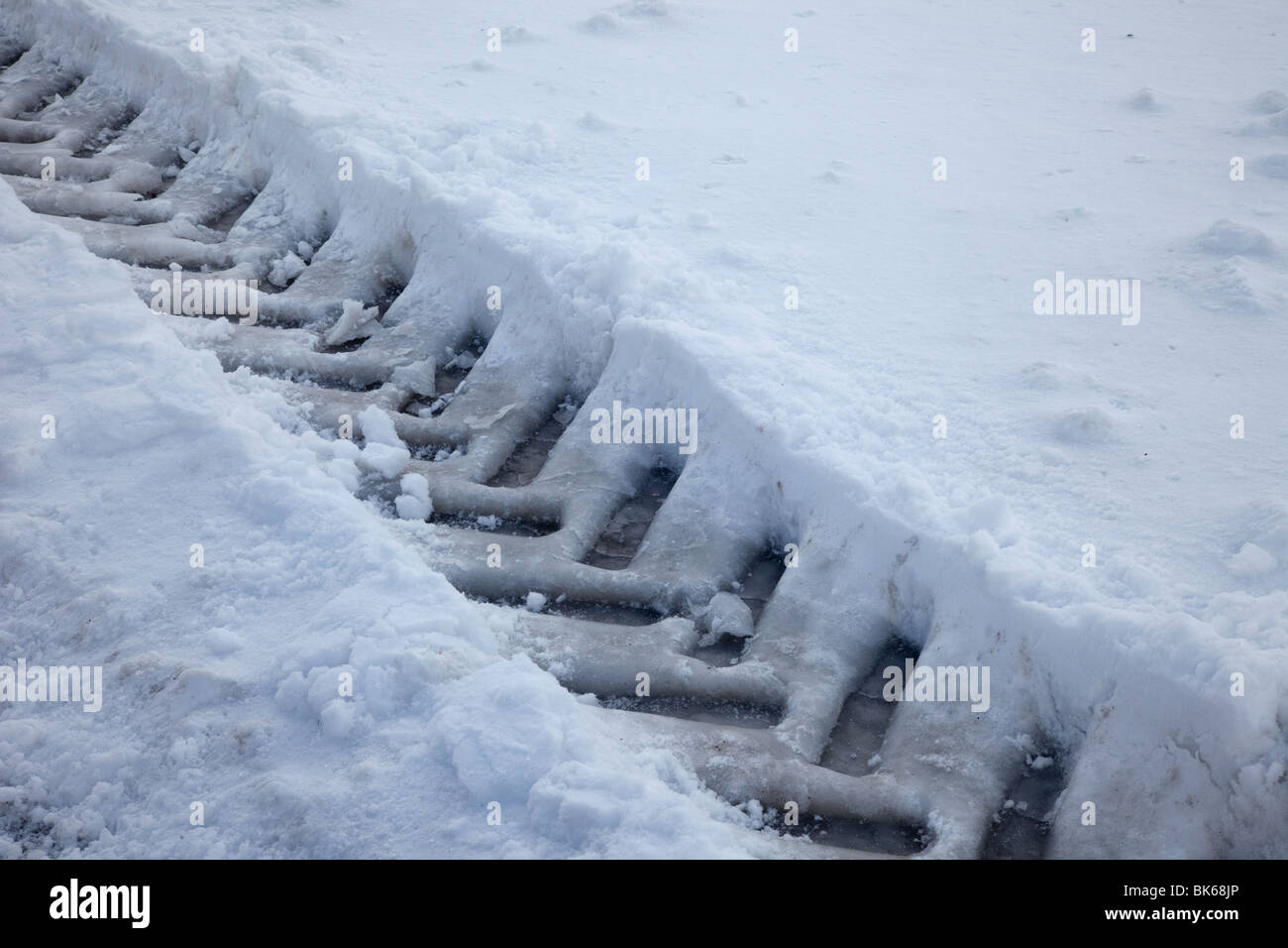 Tractor Tyre Tracks in deep Snow, UK Stock Photo Alamy