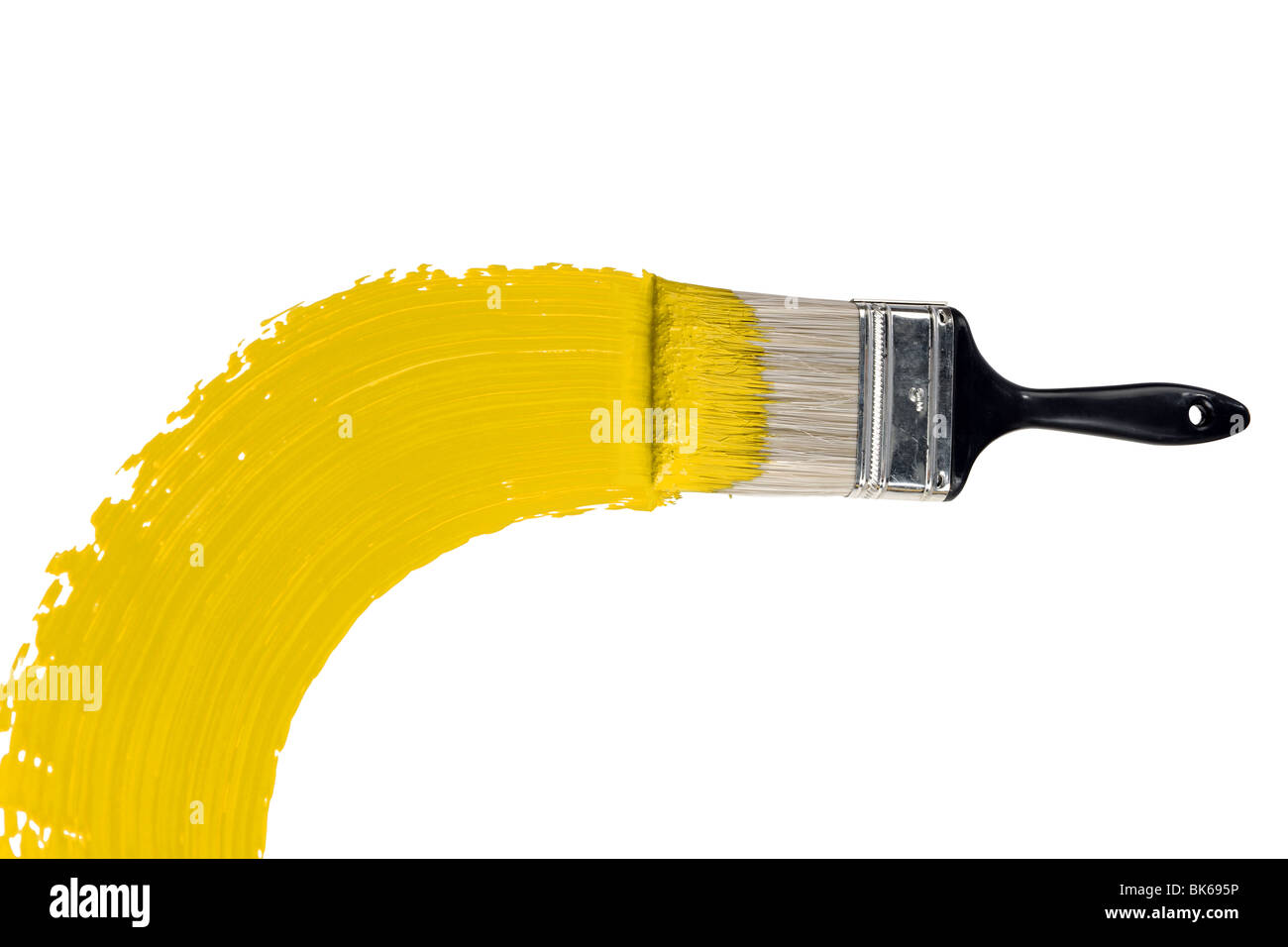 Brush with yellow paint isolated over white background Stock Photo