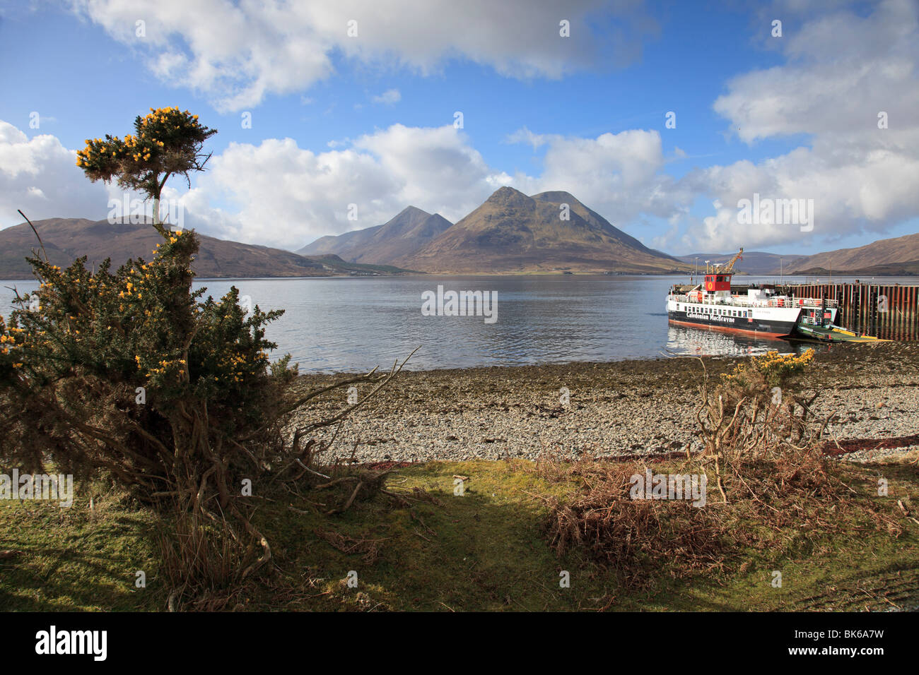View from Inverarish on the Isle of Raasay to the Cuillin mountains on the Isle of Skye with Raasay Ferry waiting to sail Stock Photo