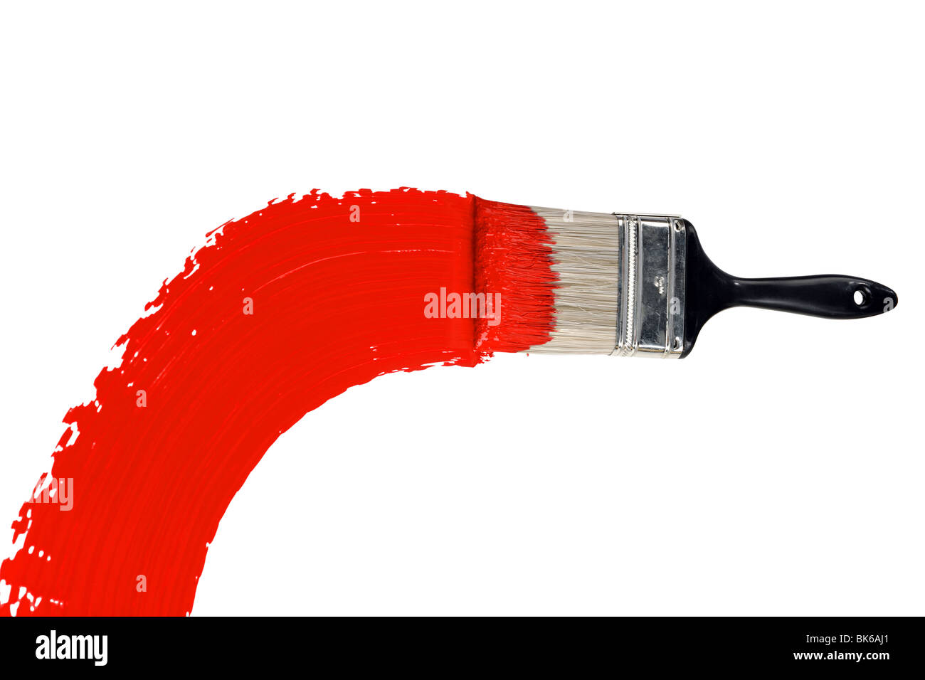 Brush with red paint isolated over white background Stock Photo