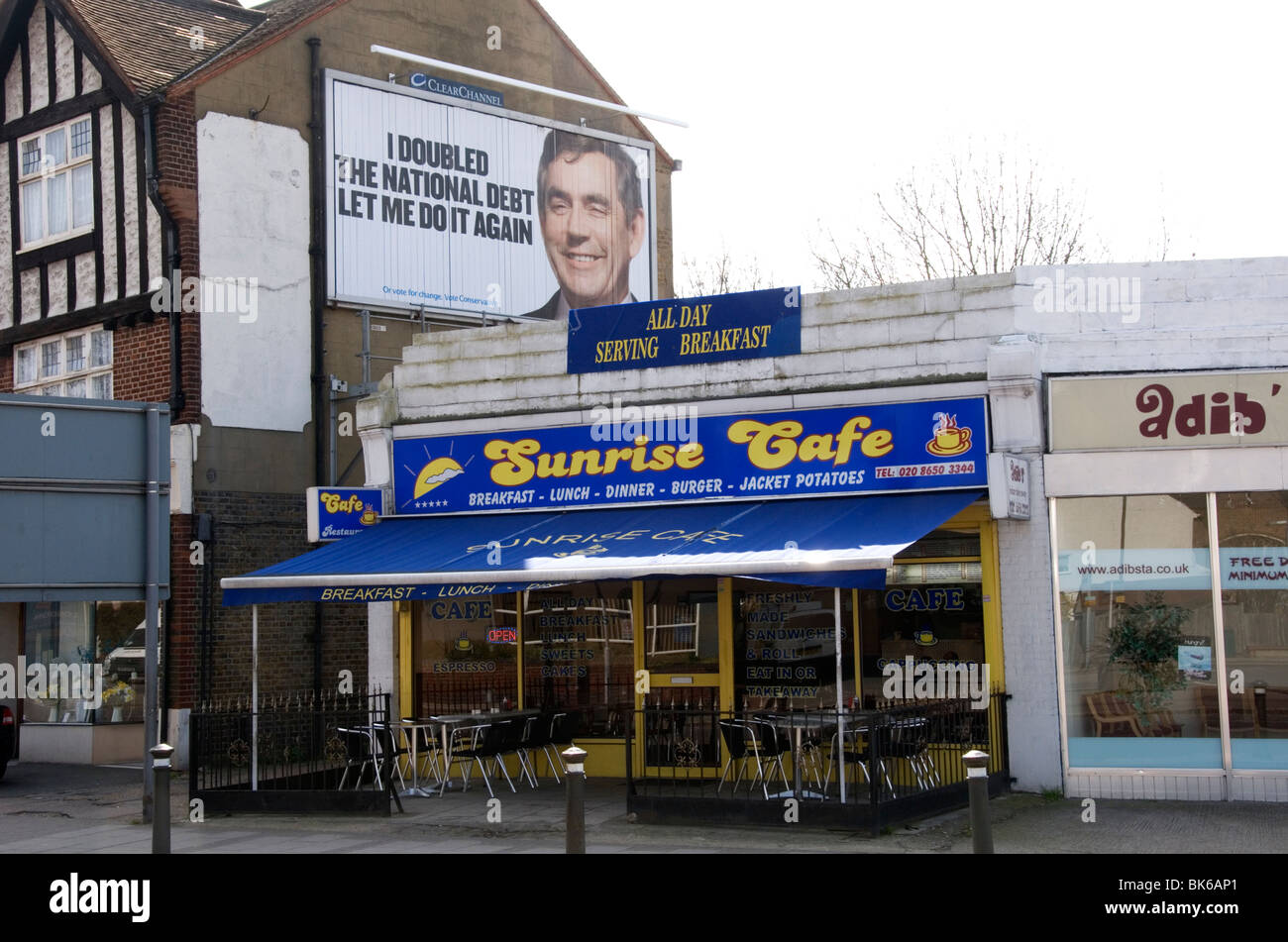 Conservative election poster above the Sunrise Cafe in Elmer's End, South London Stock Photo Alamy