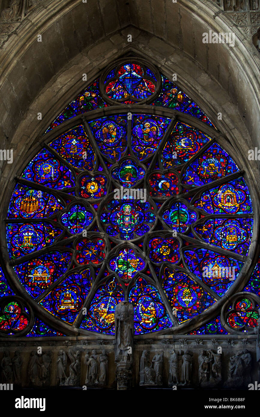 Stained glass Rose window above the main portal at the West End of Cathedrale Notre Dame de Reims Stock Photo