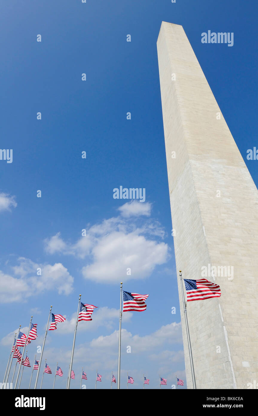 washington monument in Washington DC against blue sky with american ...