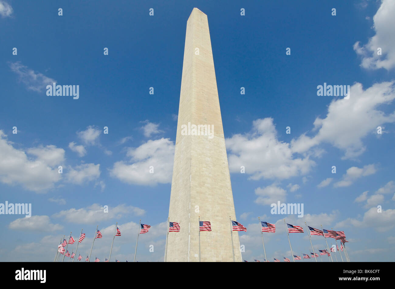 washington monument in Washington DC against blue sky with american ...