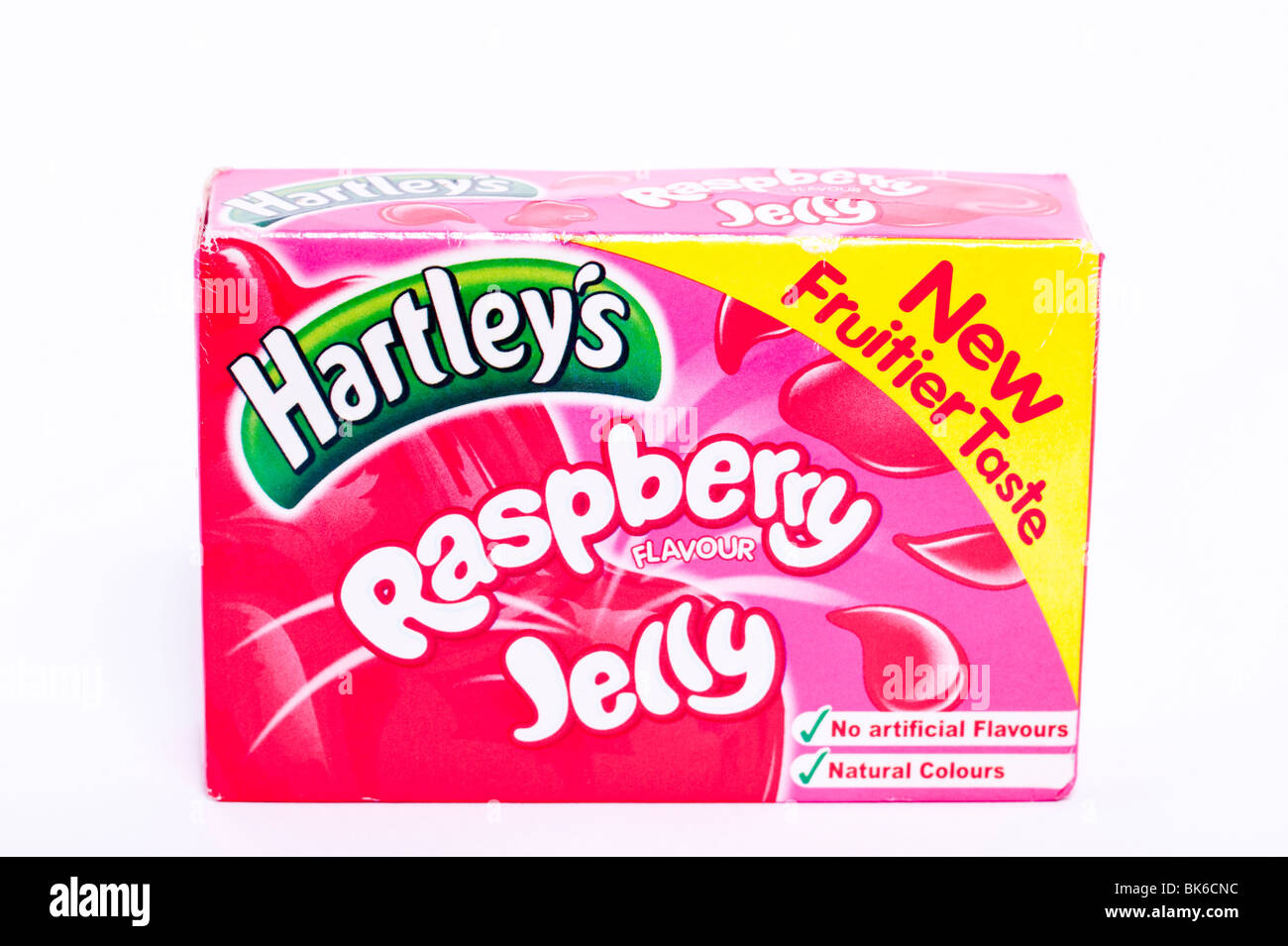 A pack of hartley's raspberry flavour Jelly with no artificial colours on a white background Stock Photo