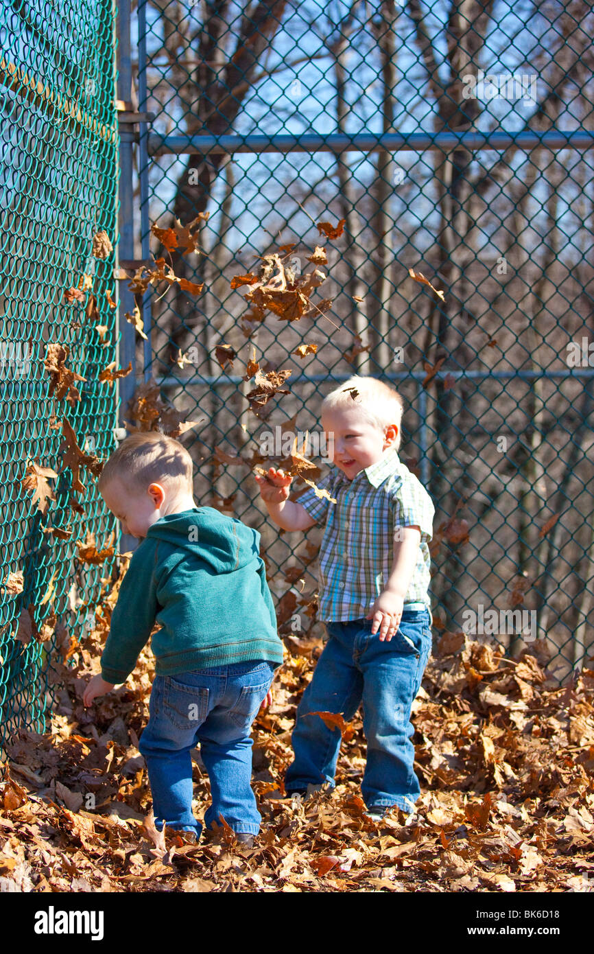 Playing in the leaves at a park in South Orange, New Jersey Stock Photo