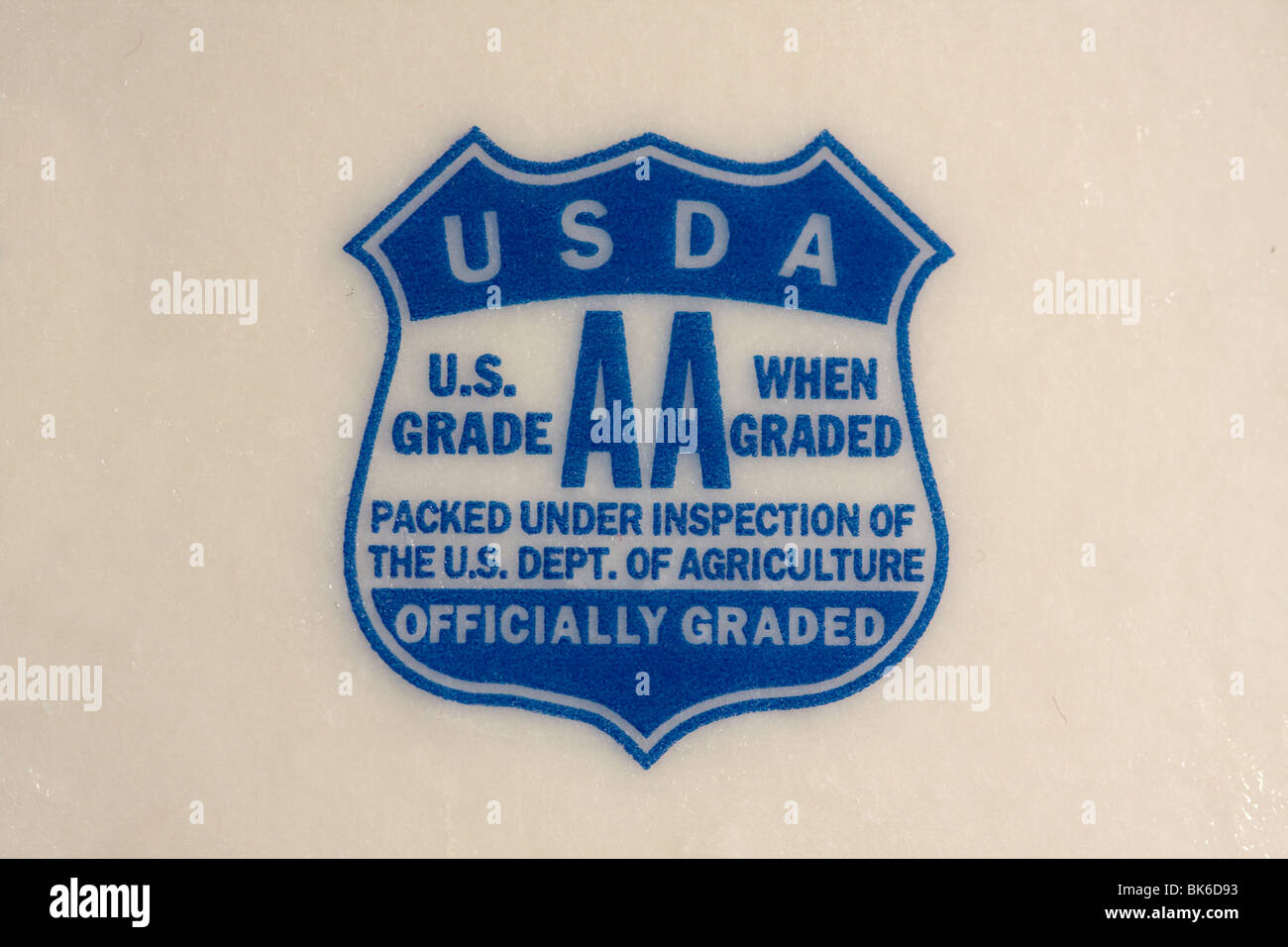 Inspection Stamp 'USDA U.S. GRADE AA WHEN GRADED PACKED UNDER INSPECTION OF THE U.S. DEPT. OF AGRICULTURE OFFICIALLY GRADED' Stock Photo