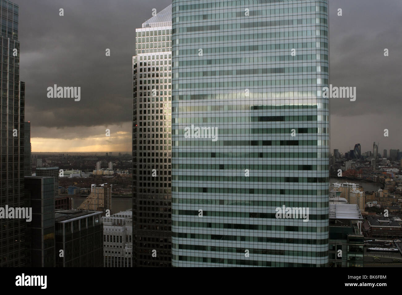 a view across London, on an overcast day, from 27th floor of Barclays Bank, Canary Wharf. HSBC HQ in foreground Stock Photo