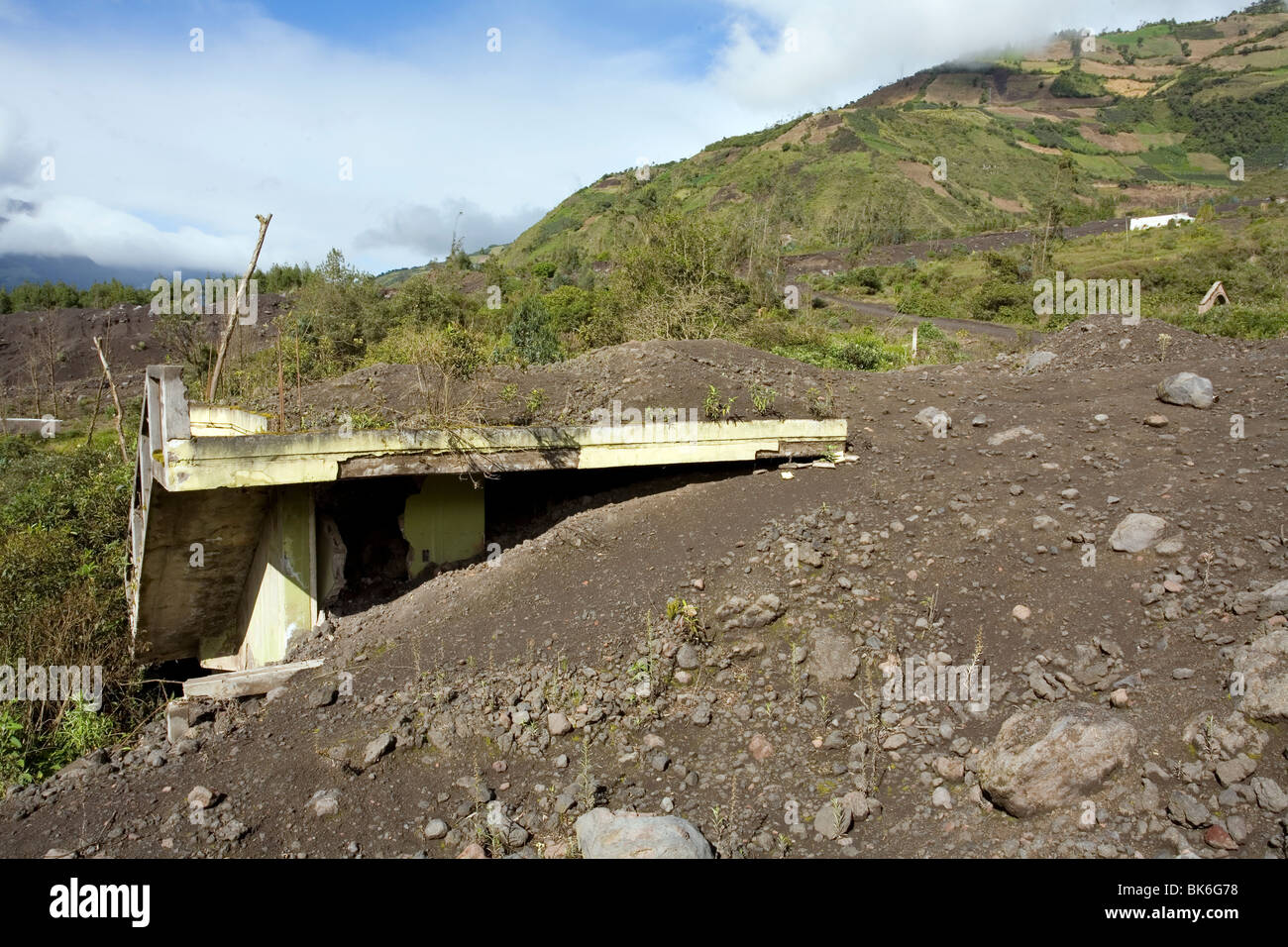 House buried in a lahar or ash flow from Tungurahua Volcano, Ecuador Stock Photo
