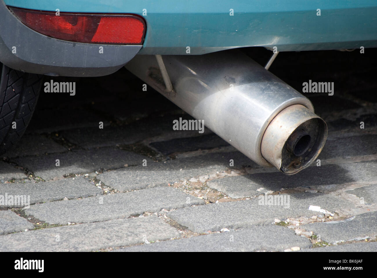 Megaphone silencer on a small car all noise and no action Stock Photo