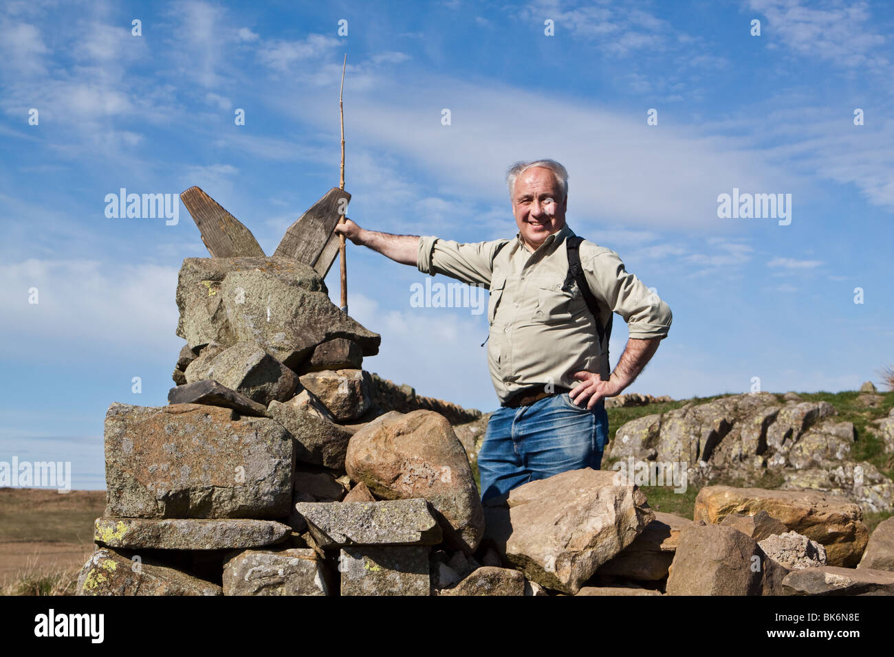 Walker Standing by a Stile on Hadrian's Wall Path Stock Photo