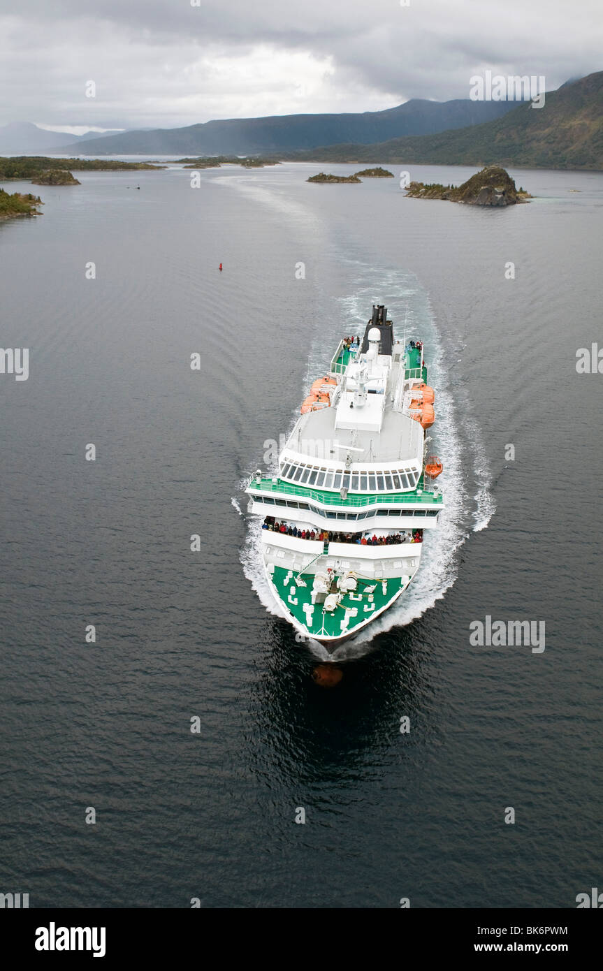 The coastal express liner Hurtigruten 'Kong Harald' seen from above in the fjord Raftsundet, North Norway. Stock Photo