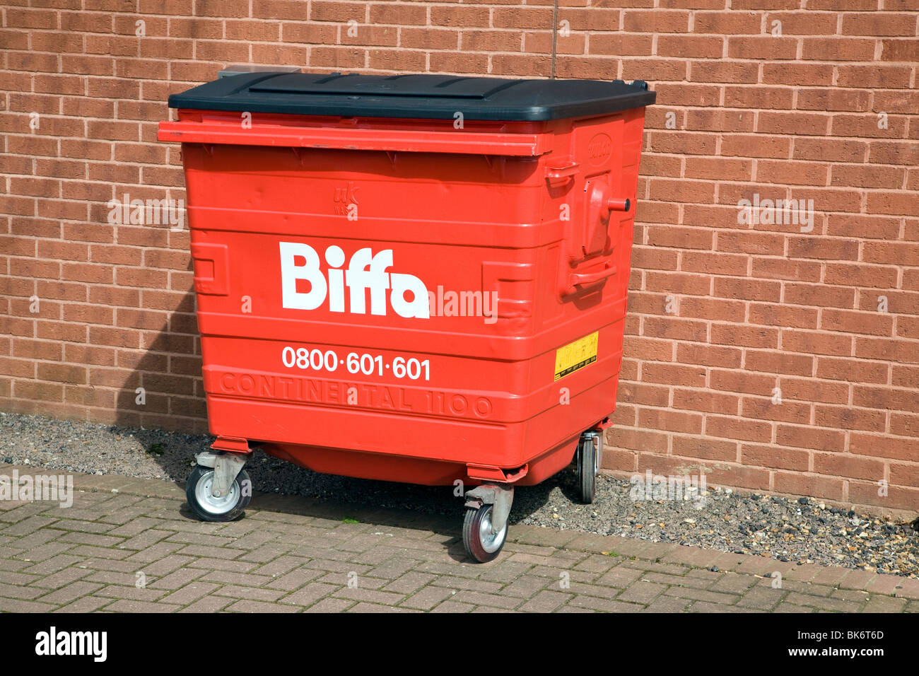 Red Biffa waste wheelie bin Stock Photo