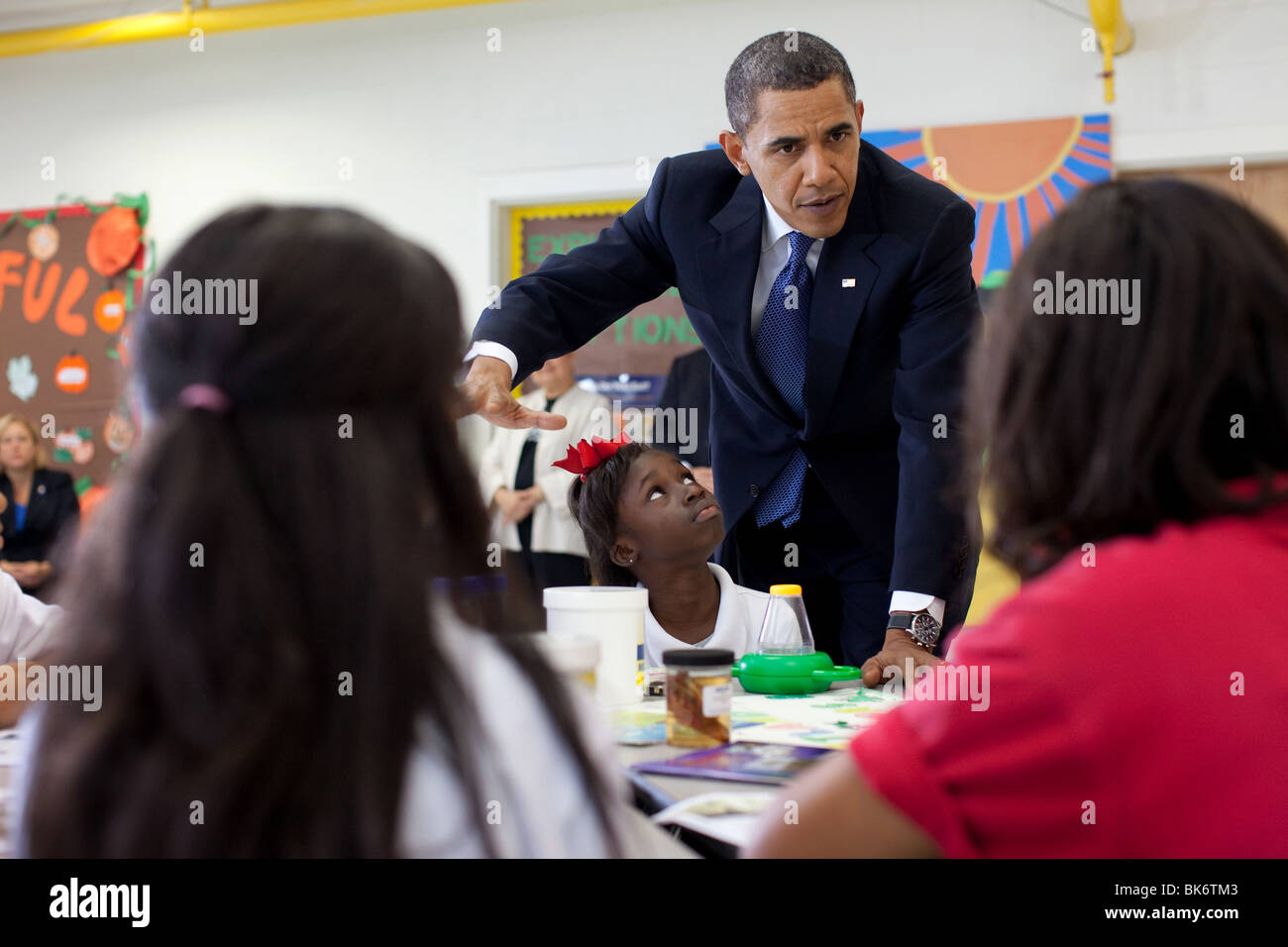President Barack Obama talks with students during a visit to the Dr. Martin Luther King Jr. Charter School in New Orleans Stock Photo